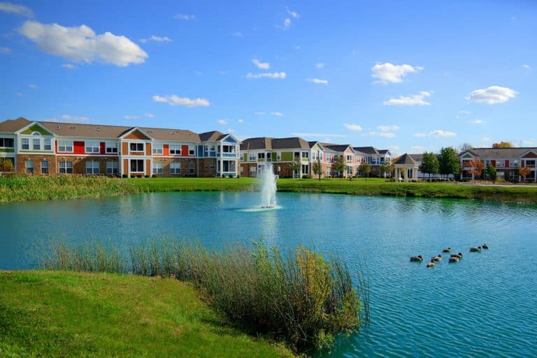 Relax by the sparkling pond at our apartments near Austin Landing.