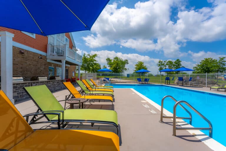 Austin Springs Apartments pool photo and loungers.