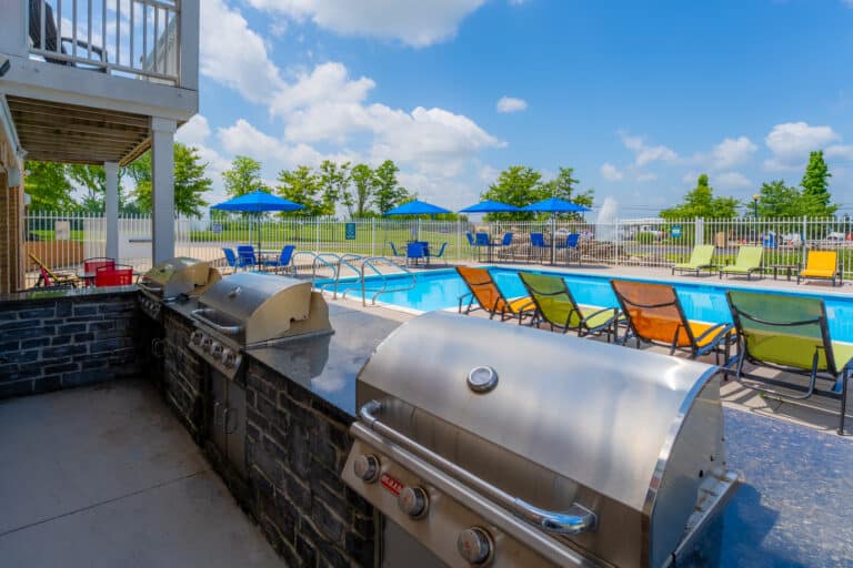Austin Springs Apartments pool photo showing the grills.