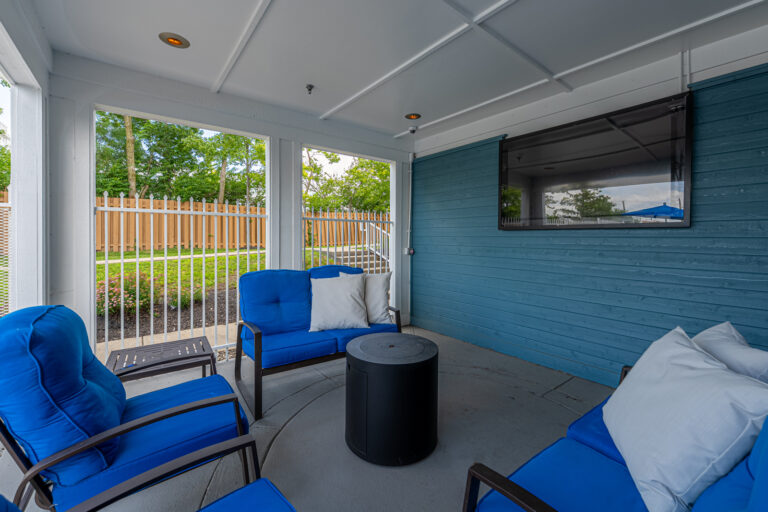 Austin Springs Apartments pool lounge with a tv.